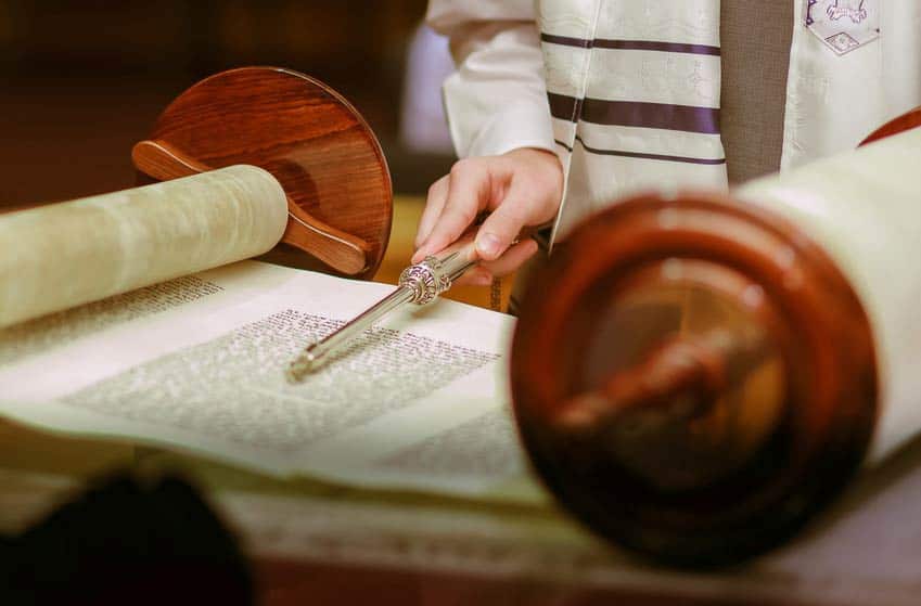 Cantor reading the torah in synagogue