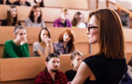 College Music Teacher lecturing students in class