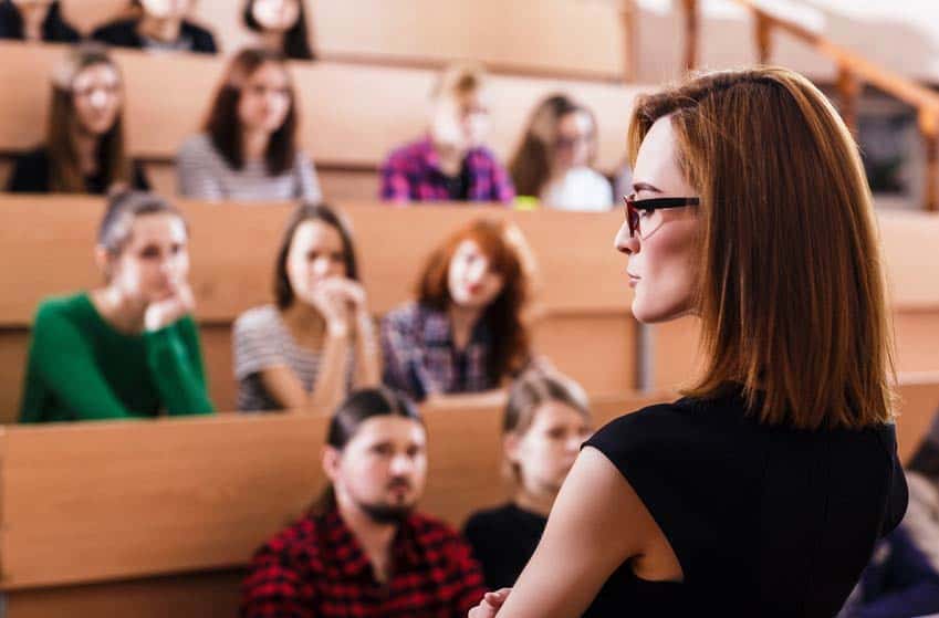 College Music Teacher lecturing students in class