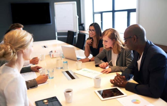 Consumer Researcher reporting results to staff in a boardroom