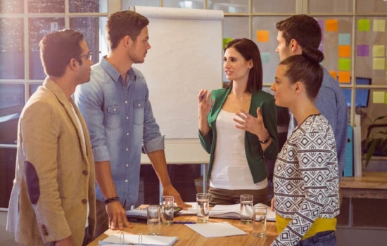 District Supervisor of Music in a meeting with four Music Teachers