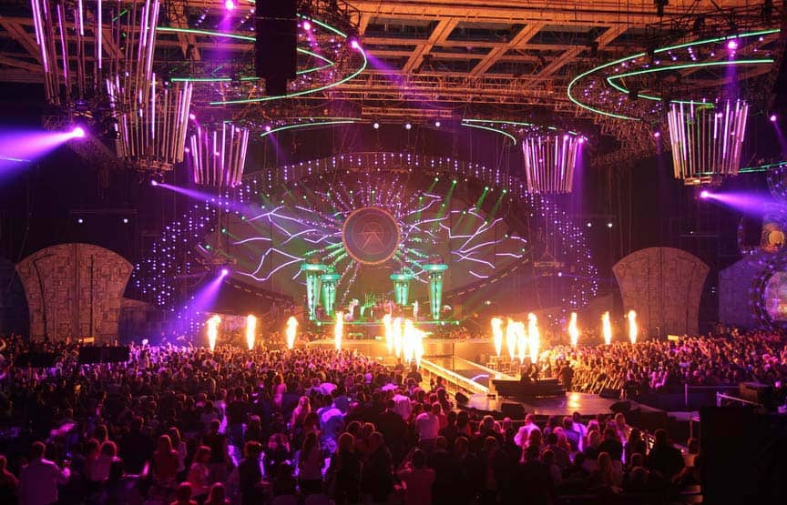 Interior of a large nightclub with an impressive light show taking place