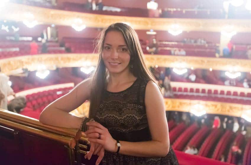 Personnel Director of an orchestra standing on the upper level of the theatre