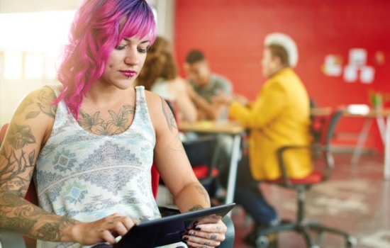 Professional Manager on tablet in her office