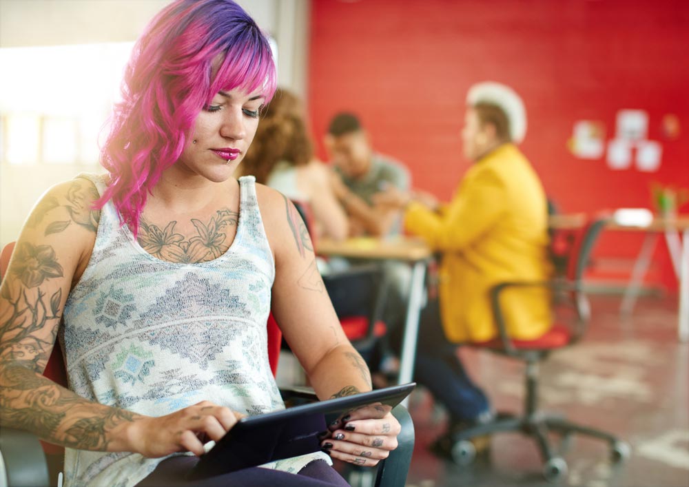 Professional Manager on tablet in her office