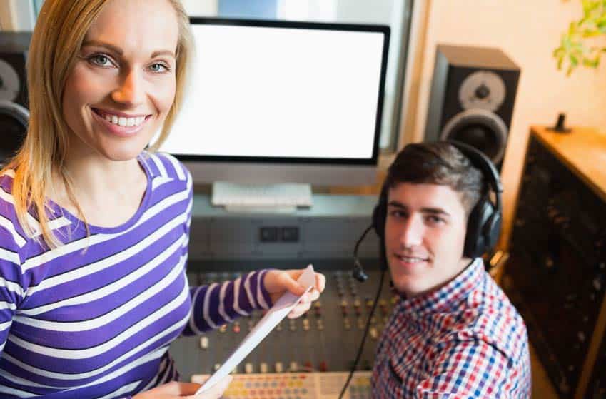 Program Director talking to DJ in the radio station studio