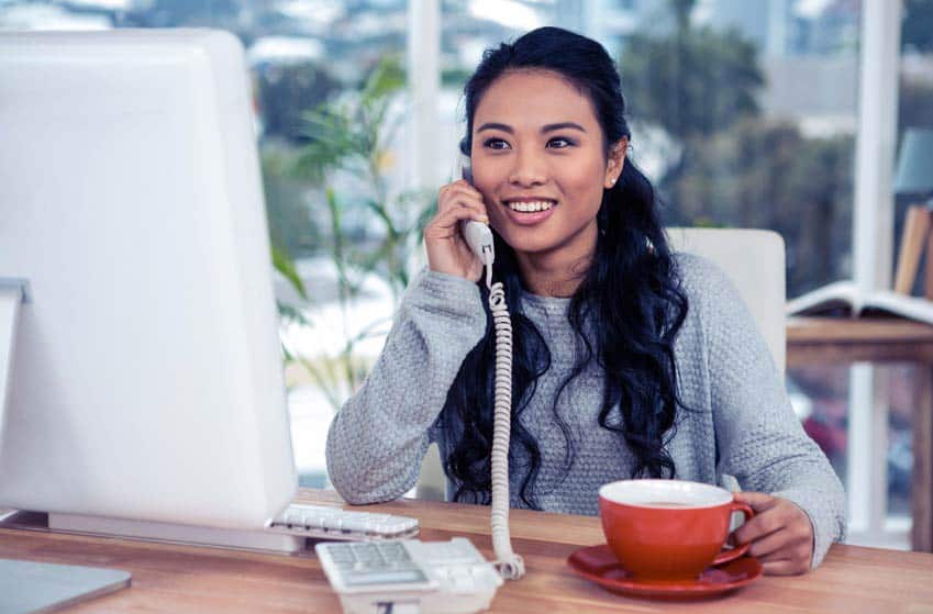 Promotion Staffer on the phone in her office