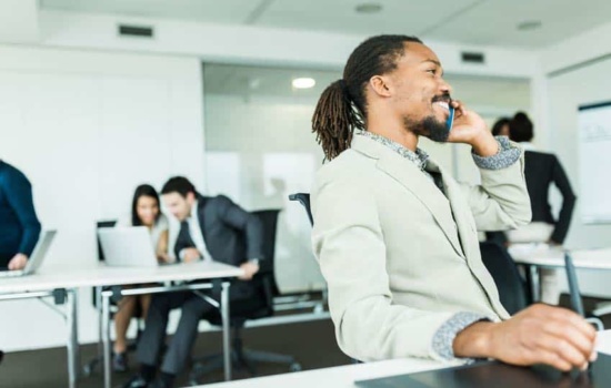 Public Relations Counselor on the phone in his office