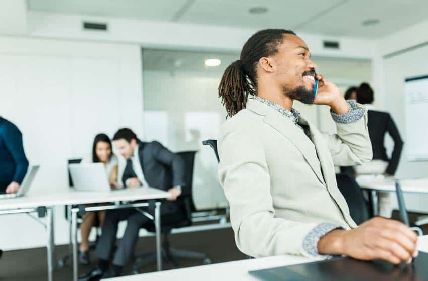 Public Relations Counselor on the phone in his office