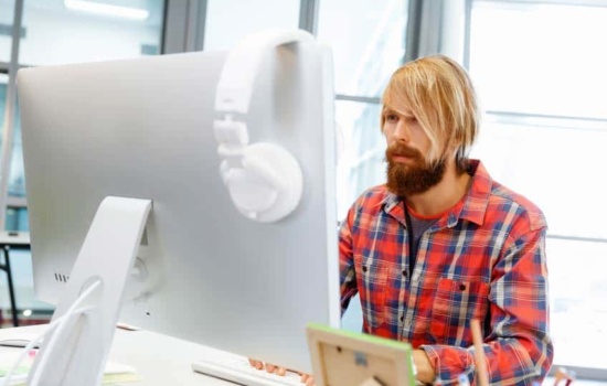 Record Company Salesperson looking at his computer