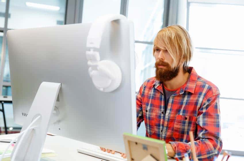 Record Company Salesperson looking at his computer