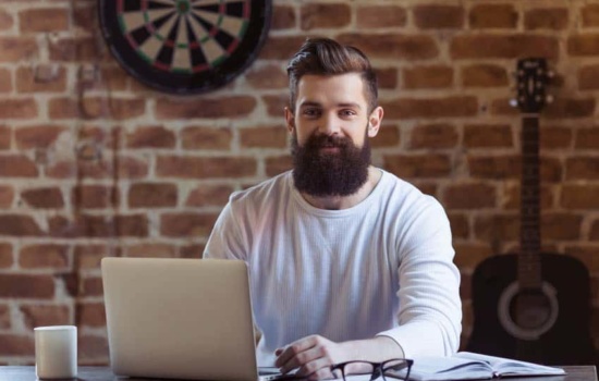 Recording Artist Website Content Producer at work in his office