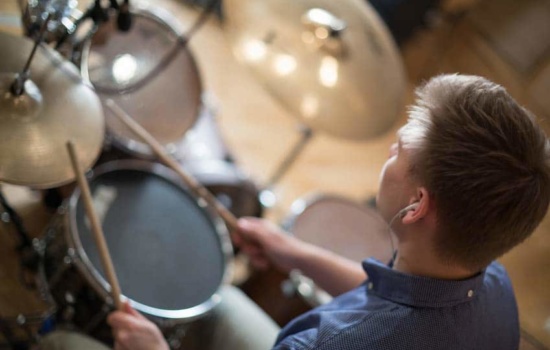 Male Session Musician playing the drums