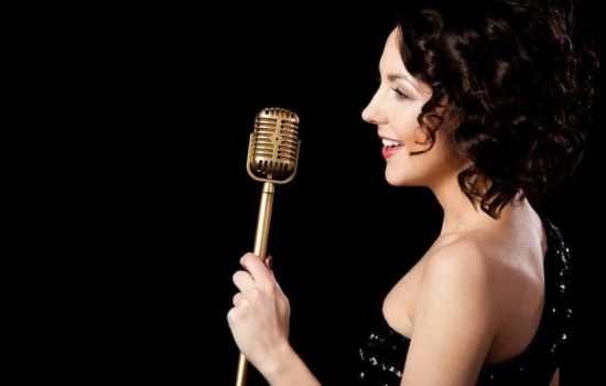 Female show band singer holding microphone