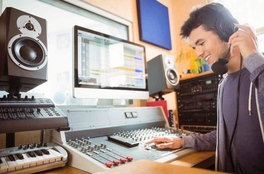 Sound Designer working in his recording studio