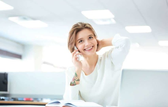 Subscriptions & Ticket Service Director talking on the phone with potential donor