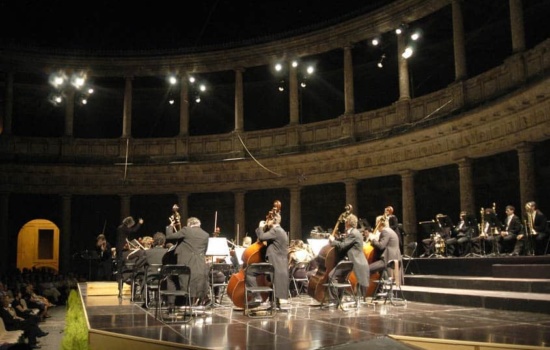 Symphony performing on stage at outdoor amphitheatre