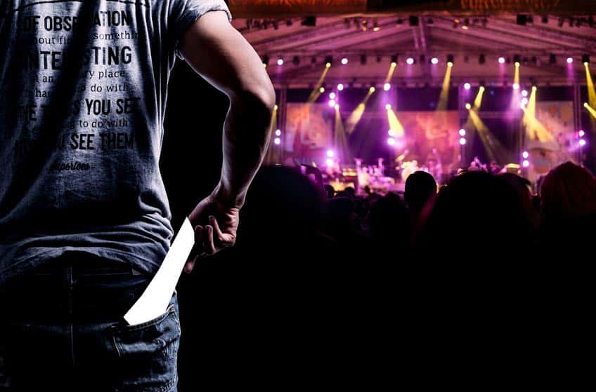 Tour Coordinator watching a live concert from the back of the room