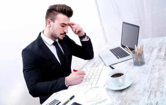 Advance Person checking the tour schedule in his office