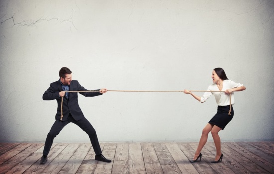 Two people in a Tug of War