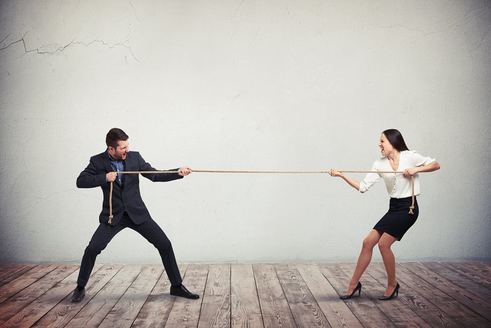 Two people in a Tug of War