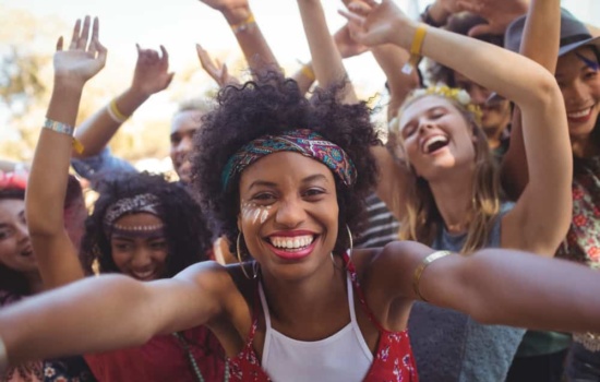 Young women enjoying a music festival