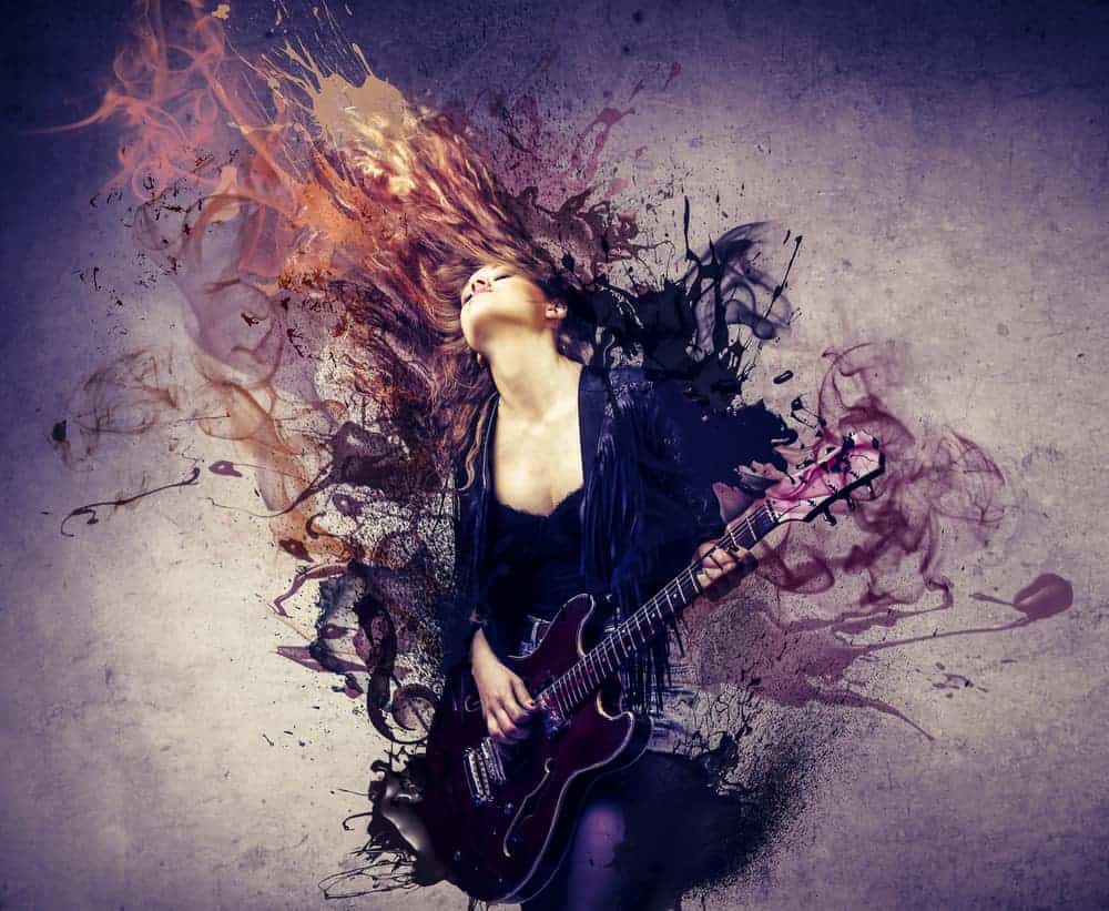 Female musician with guitar and paint swirls