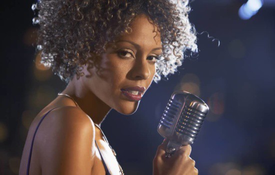 Female jazz singer holding microphone