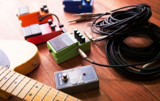 Guitar and pedals resting on the floor