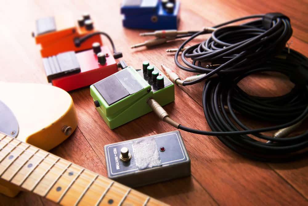 Guitar and pedals resting on the floor