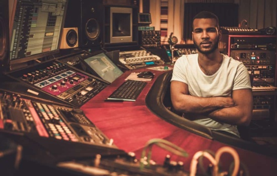 African-American sound engineer in boutique recording studio