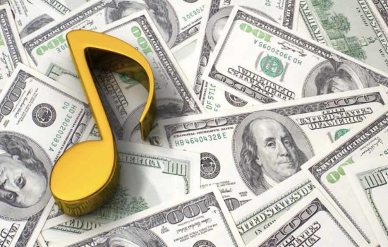 Gold music note on the background of one hundred dollar bills