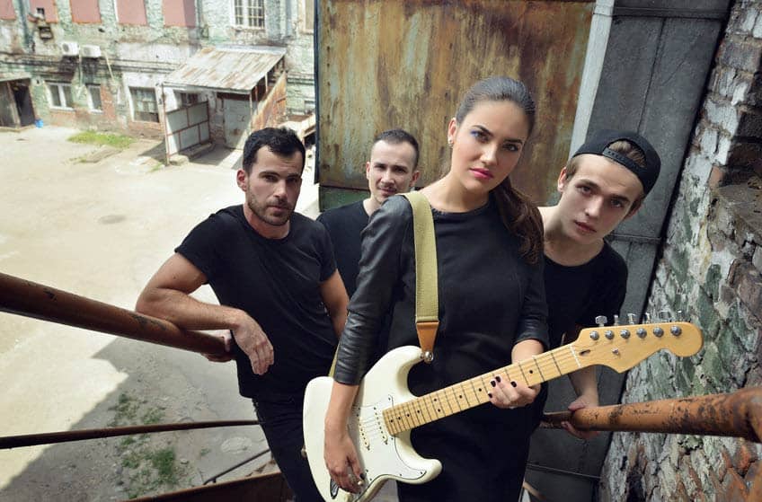 Band standing on the stairs and posing for promo photos