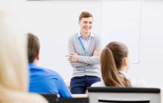 Musicologist at front of the classroom teaching college students