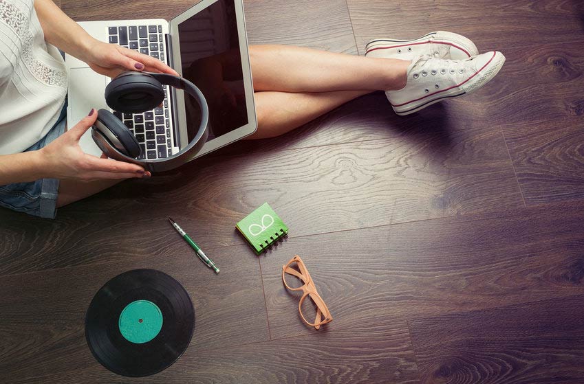 Young musician making her own music on her laptop