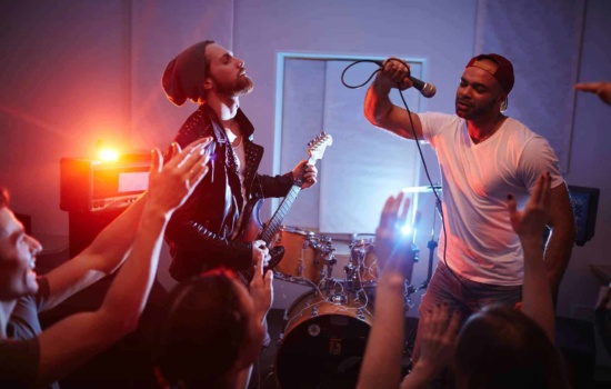 Guitar player and vocalist at rowdy concert