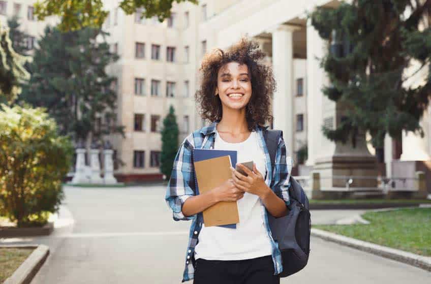 Young female music PhD student on campus