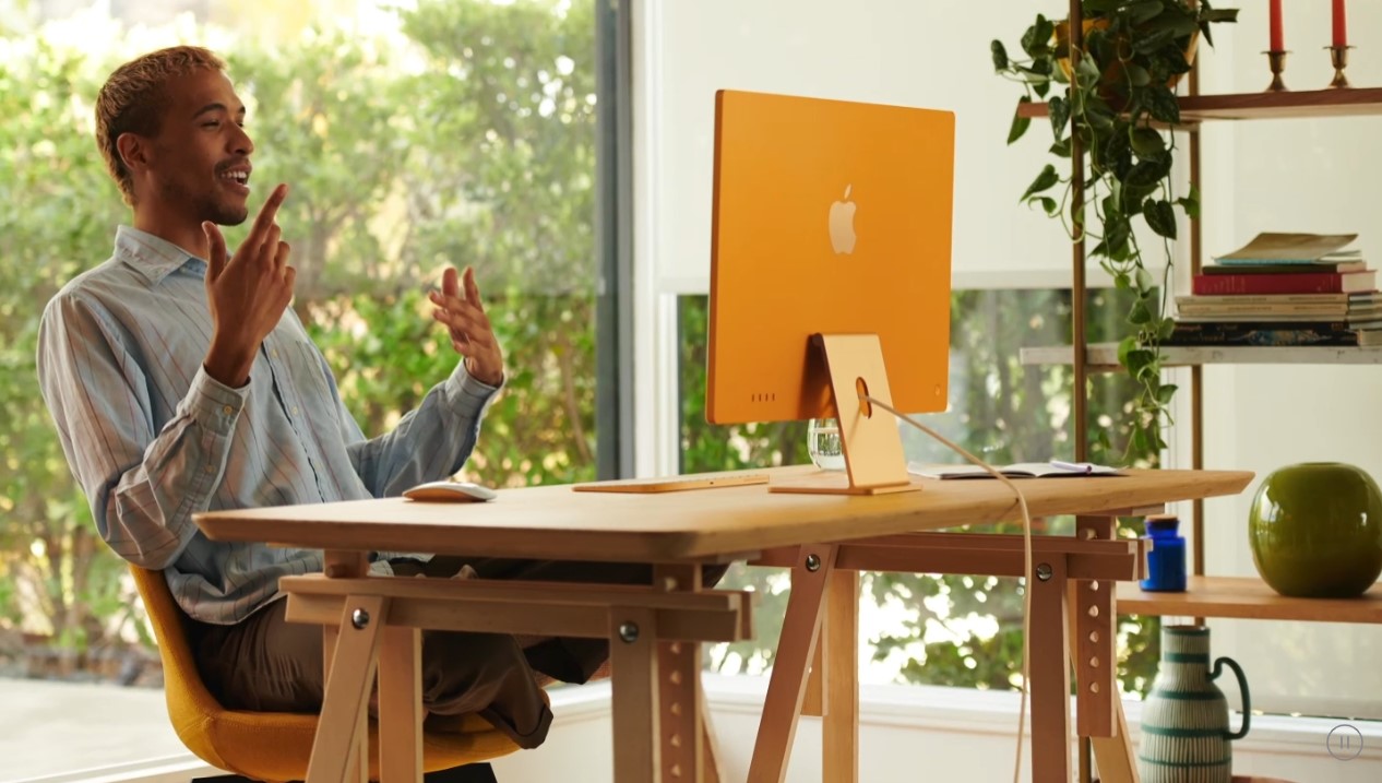 Orange coloured Apple iMac