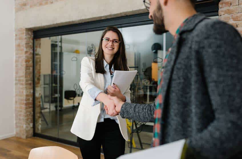 Record label internship meeting between young female student and older male colleague