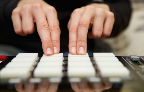 Beat maker machine with person playing