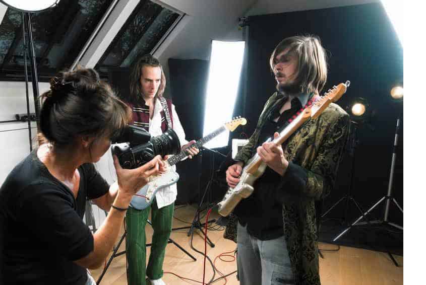 Bandmates and director shooting a music video