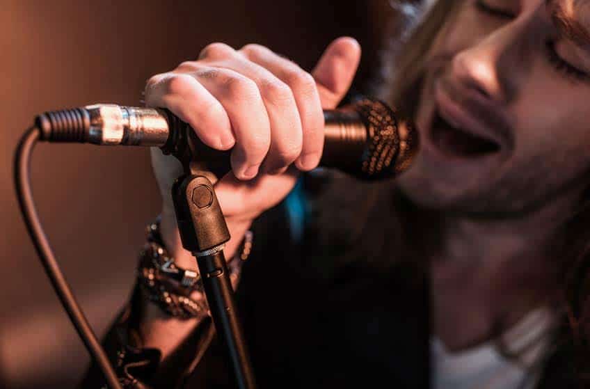 Closeup of male rock singer and microphone