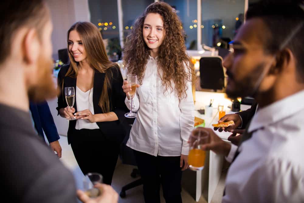 Young female intern networking at a music employment event