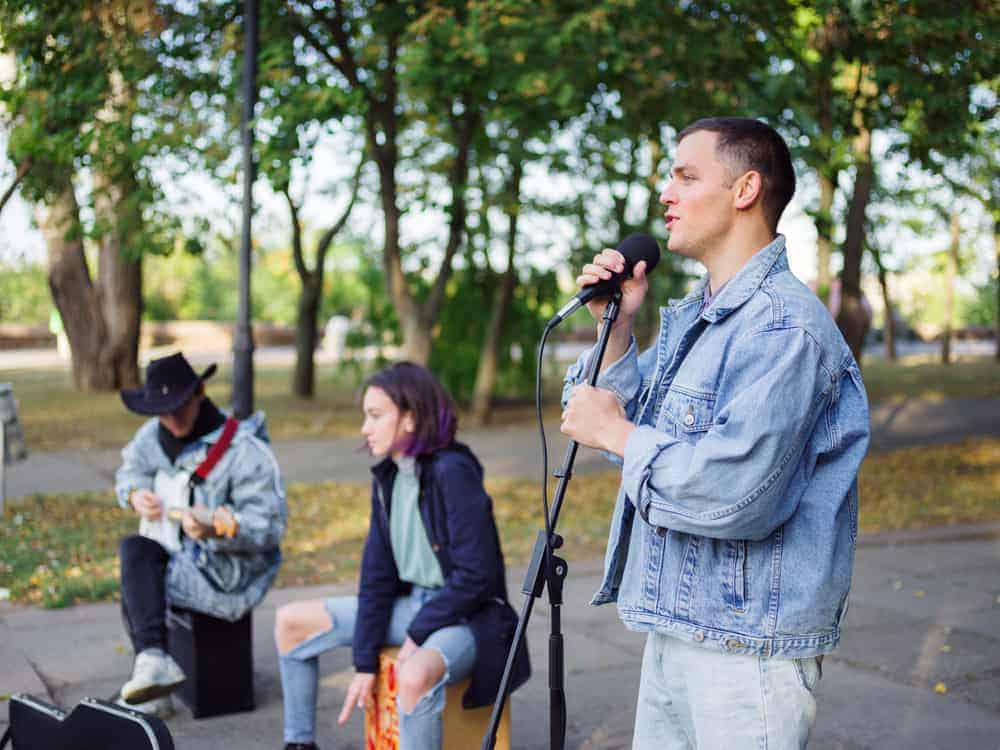 Band using portable sound system outdoors