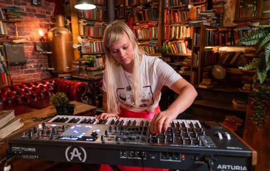 Woman playing one of the year's best synthesizers