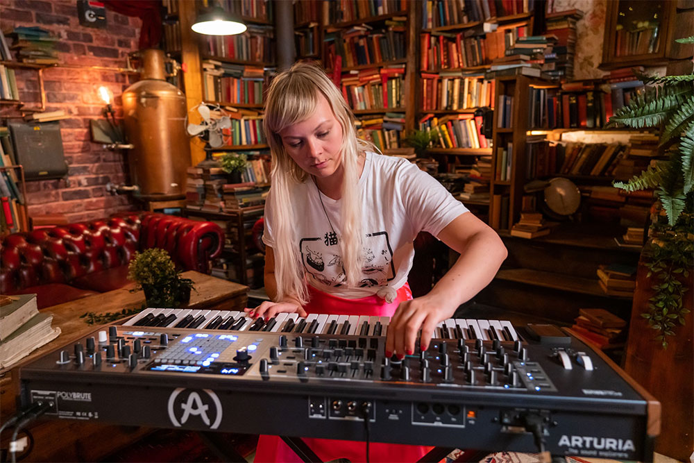 Woman playing one of the year's best synthesizers