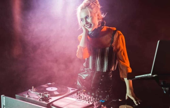 Female DJ with turntables and setup