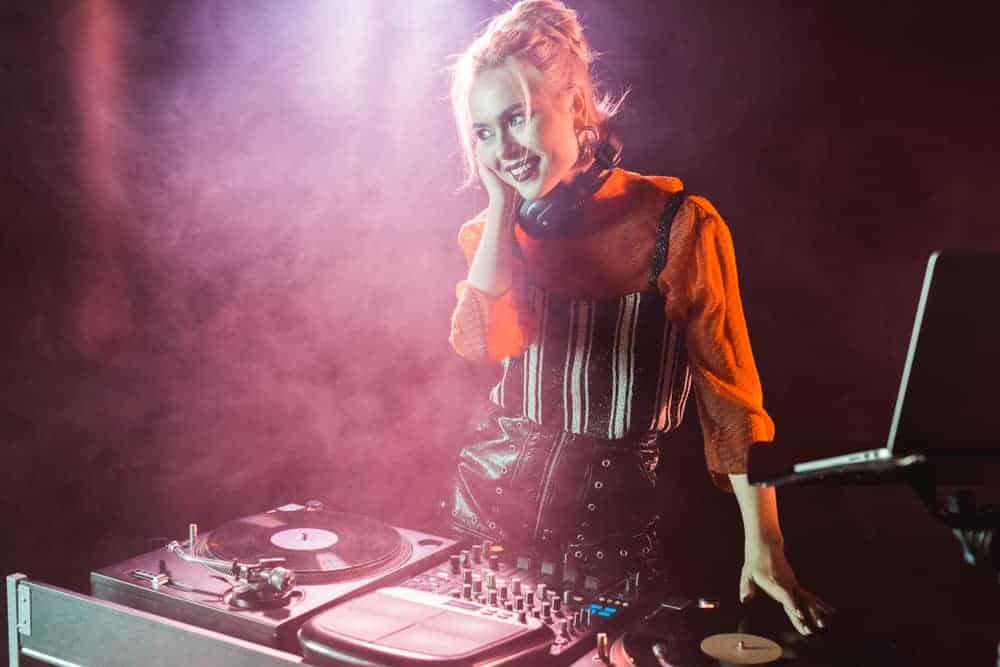Female DJ with turntables and setup