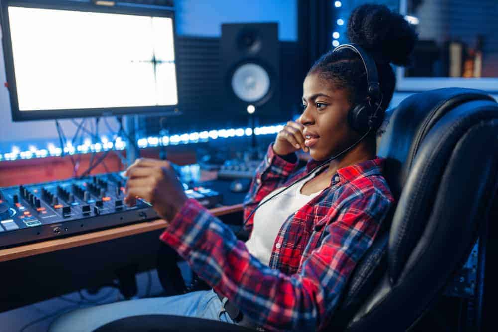 Black female producer in her home studio setup