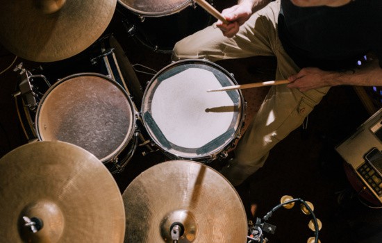 Overhead shot of drummer playing drum kit